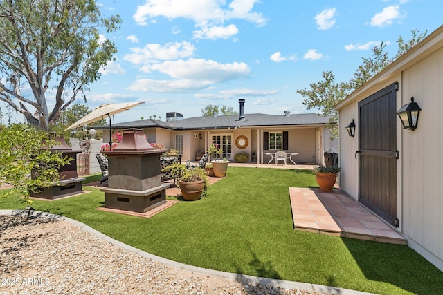 3201 E Colter St, Phoenix, AZ 85018 - rear view of property featuring a patio and a yard