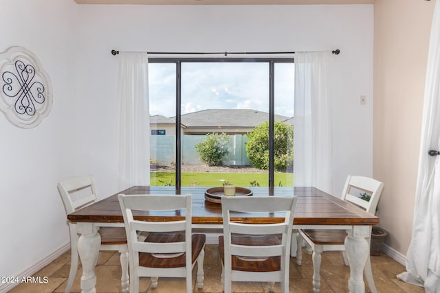 dining room featuring baseboards