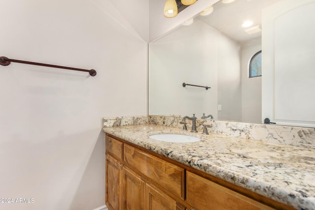 bathroom with baseboards and vanity