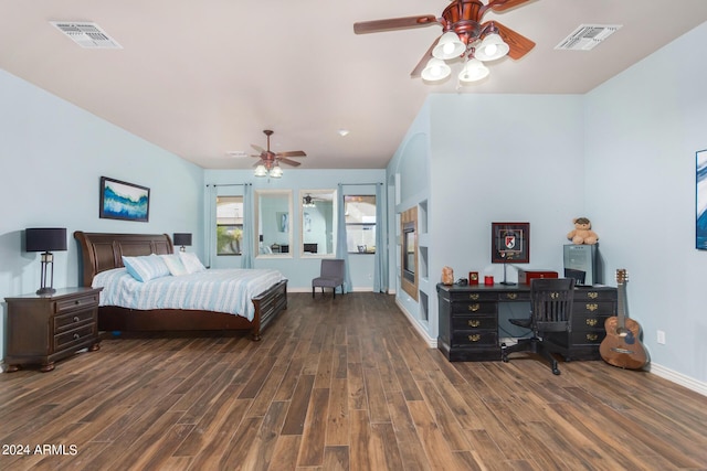 bedroom featuring a ceiling fan, baseboards, visible vents, and wood finished floors