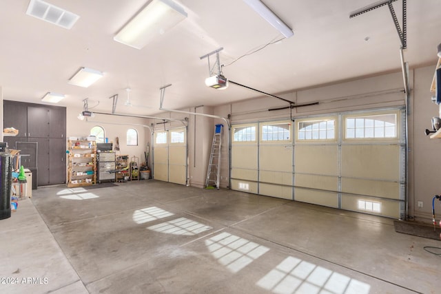 garage with visible vents and a garage door opener
