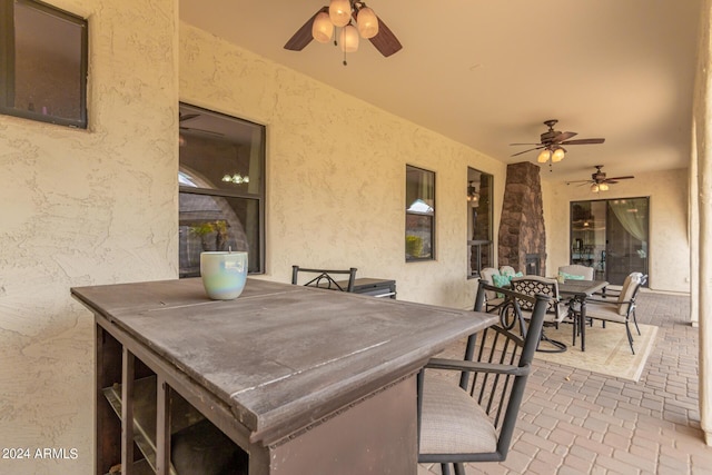 view of patio / terrace featuring outdoor dining area and ceiling fan