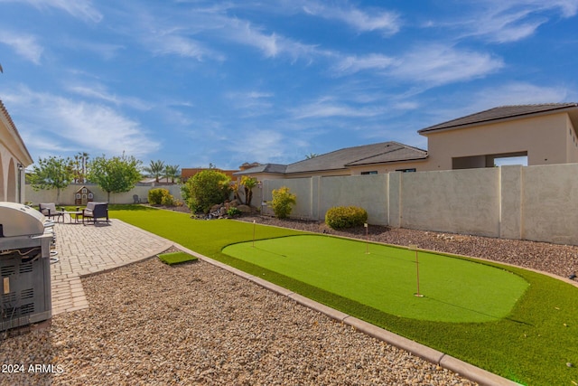 view of yard featuring a fenced backyard and a patio area