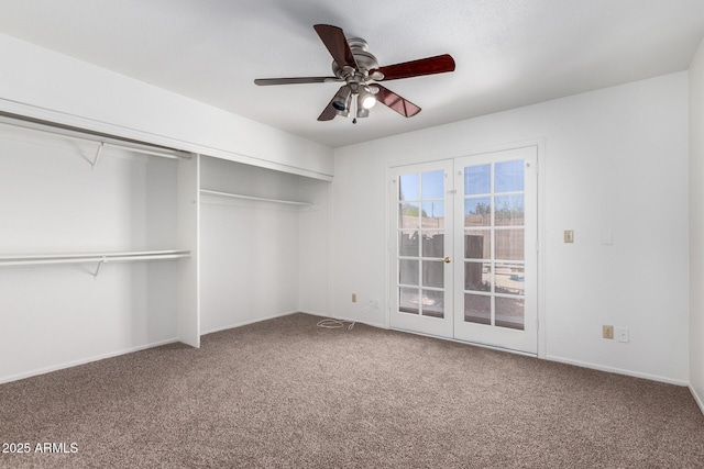 unfurnished bedroom with baseboards, a closet, a ceiling fan, and carpet floors
