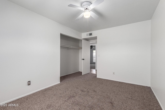 unfurnished bedroom featuring a closet, baseboards, carpet, and visible vents