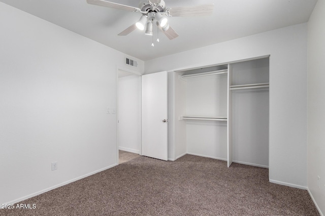 unfurnished bedroom with a closet, carpet flooring, visible vents, and baseboards