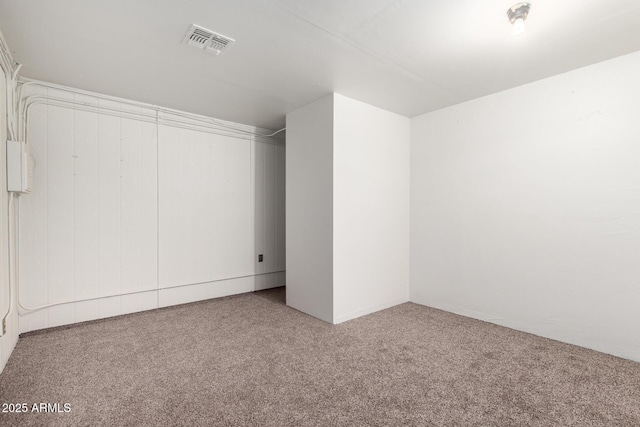 interior space with carpet flooring and visible vents