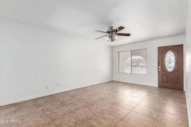 entryway with ceiling fan, baseboards, and light tile patterned floors