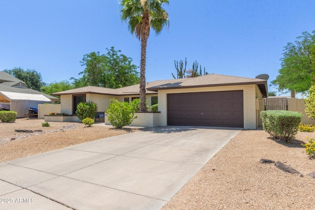 6417 E Kings Ave, Scottsdale, AZ 85254 - single story home featuring brick siding, an attached garage, and driveway