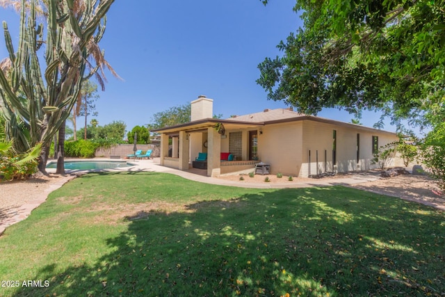 6417 E Kings Ave, Scottsdale, AZ 85254 - back of property featuring a chimney and a patio