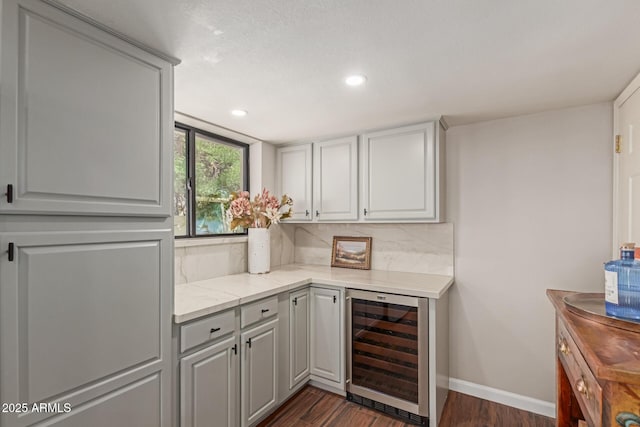 6417 E Kings Ave, Scottsdale, AZ 85254 - indoor dry bar with wine cooler, dark wood finished floors, backsplash, and recessed lighting