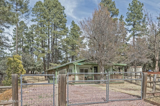 view of front of house with fence and a gate