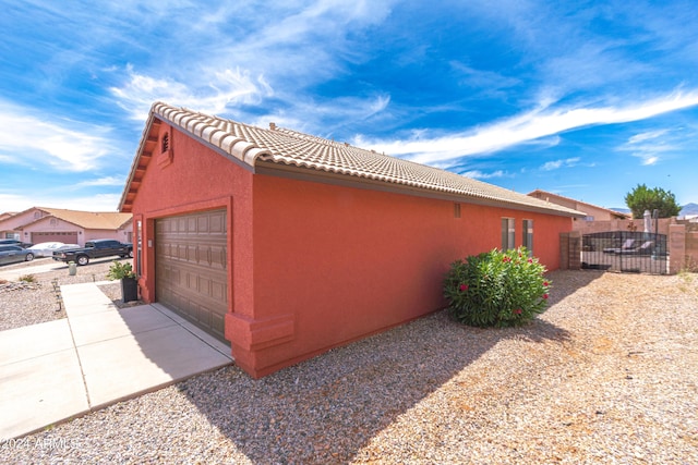 view of side of property featuring a garage