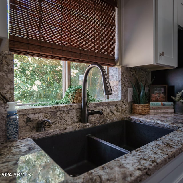 kitchen with white cabinets and sink