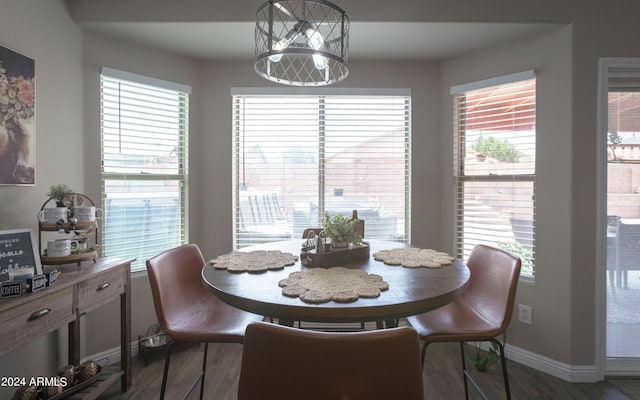 dining area featuring dark hardwood / wood-style floors and a healthy amount of sunlight