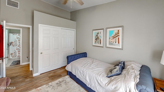 bedroom featuring wood-type flooring, a closet, and ceiling fan