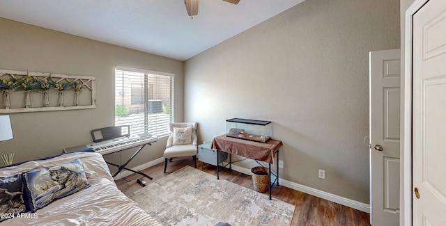 office space with ceiling fan, wood-type flooring, and vaulted ceiling