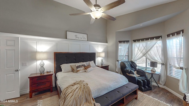 bedroom with ceiling fan and wood-type flooring