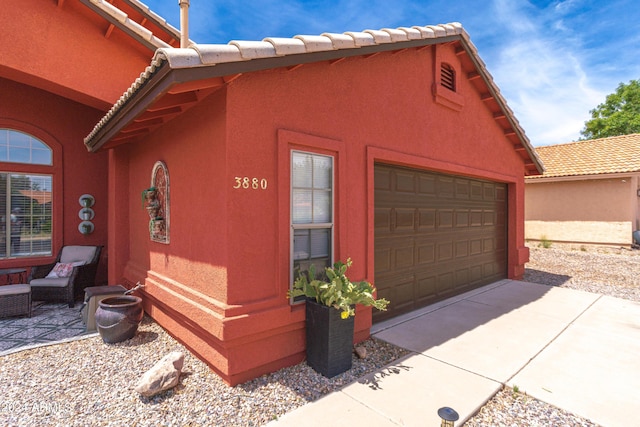 view of side of property with a garage