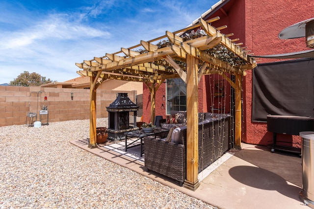 view of patio featuring a pergola and an outdoor living space