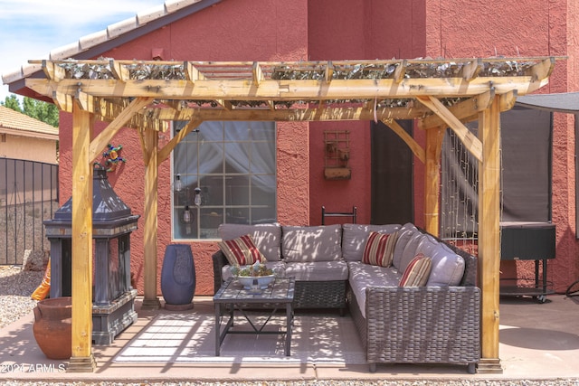 view of patio / terrace with an outdoor living space with a fireplace and a pergola