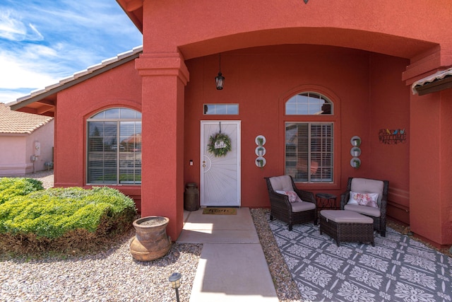 entrance to property featuring a patio