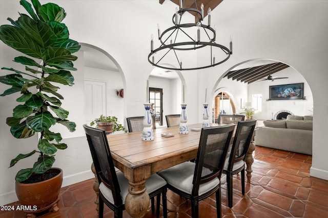 dining space featuring ceiling fan and vaulted ceiling