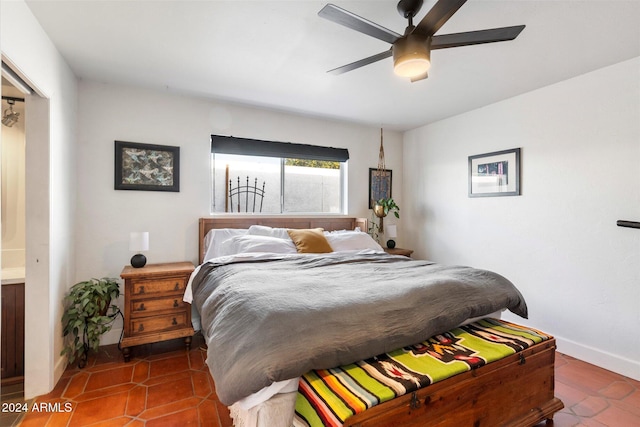 tiled bedroom featuring ceiling fan