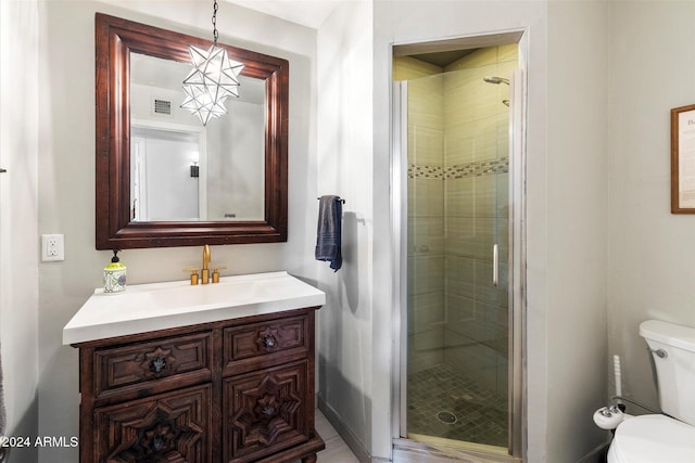 bathroom with vanity, toilet, and walk in shower