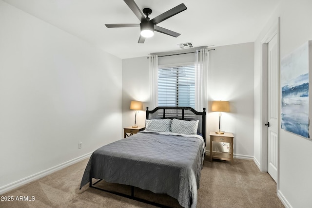 carpeted bedroom with ceiling fan, visible vents, and baseboards