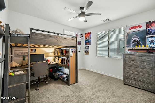 carpeted bedroom with baseboards, visible vents, and a ceiling fan