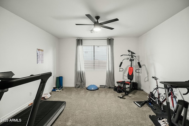 workout area featuring carpet, ceiling fan, and baseboards