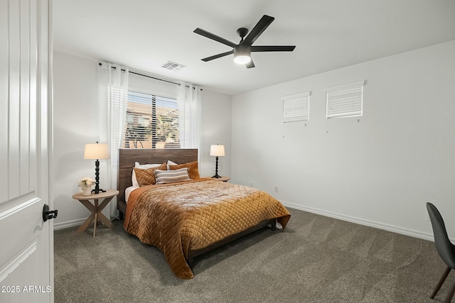 carpeted bedroom with a ceiling fan, visible vents, and baseboards