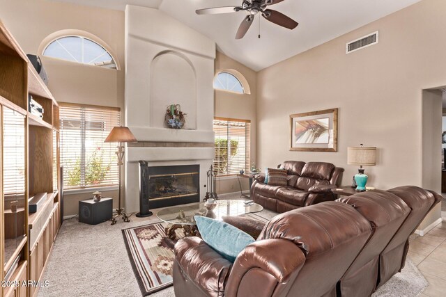 7648 W Mauna Loa Ln, Peoria, AZ 85381 - living area with ceiling fan, a fireplace, baseboards, and high vaulted ceiling