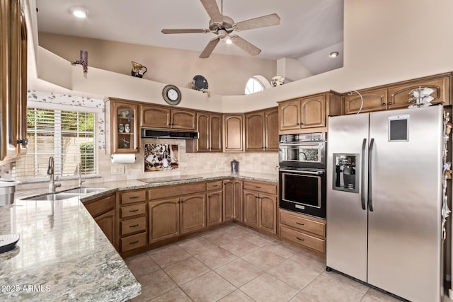 7648 W Mauna Loa Ln, Peoria, AZ 85381 - kitchen featuring stainless steel fridge, a sink, vaulted ceiling, black electric stovetop, and backsplash