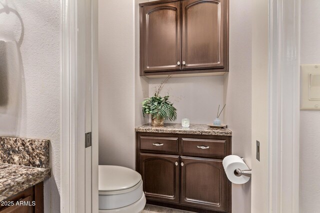 7648 W Mauna Loa Ln, Peoria, AZ 85381 - bathroom featuring vanity and toilet