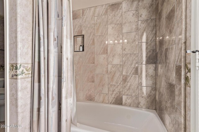 7648 W Mauna Loa Ln, Peoria, AZ 85381 - bathroom with shower / bathtub combination with curtain