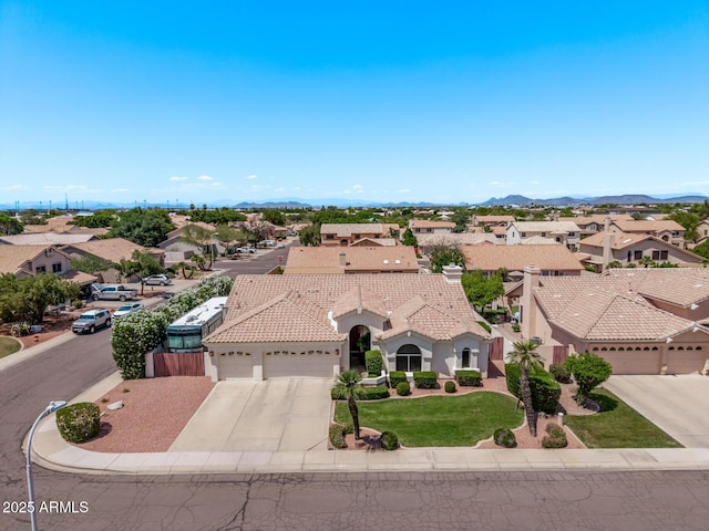 7648 W Mauna Loa Ln, Peoria, AZ 85381 - aerial perspective of suburban area with mountains
