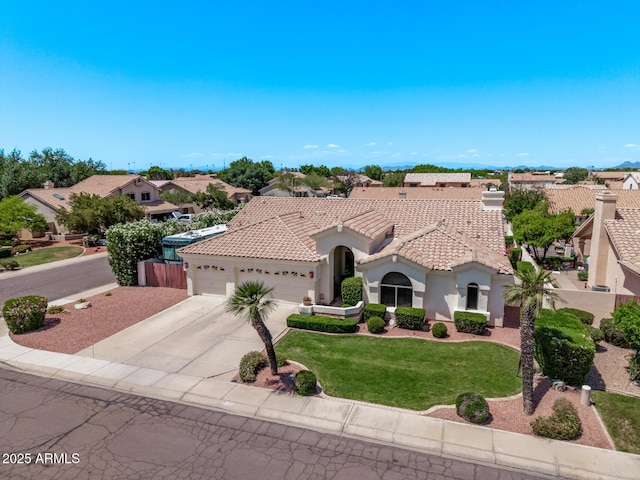 7648 W Mauna Loa Ln, Peoria, AZ 85381 - mediterranean / spanish-style house with an attached garage, a tile roof, driveway, stucco siding, and a front yard