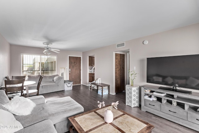 7474 E Earll Dr Unit 311, Scottsdale, AZ 85251 - living room featuring ceiling fan and dark wood-type flooring