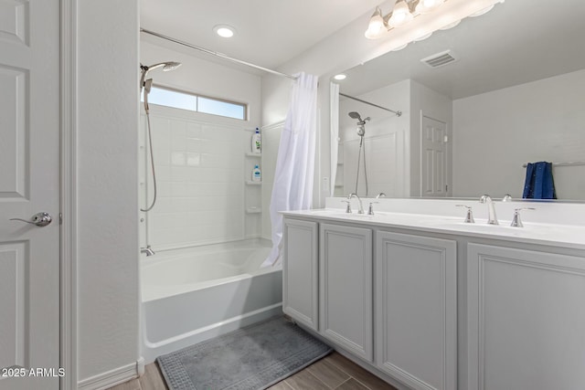 3714 S 58th Dr, Phoenix, AZ 85043 - full bathroom with shower / bath combo with shower curtain, double vanity, and wood finished floors