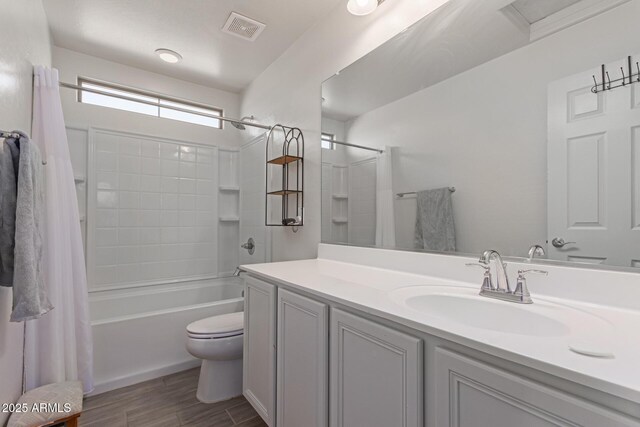 3714 S 58th Dr, Phoenix, AZ 85043 - full bathroom featuring toilet, vanity, shower / bath combo with shower curtain, and wood finished floors