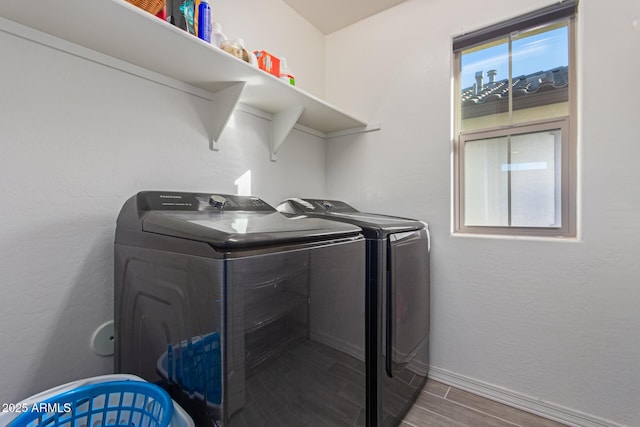 3714 S 58th Dr, Phoenix, AZ 85043 - laundry room with washer and clothes dryer, baseboards, and wood finish floors