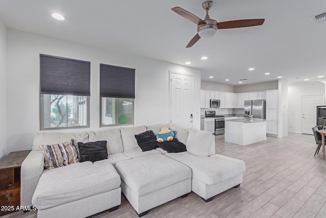 3714 S 58th Dr, Phoenix, AZ 85043 - living area with ceiling fan, recessed lighting, and light wood-type flooring