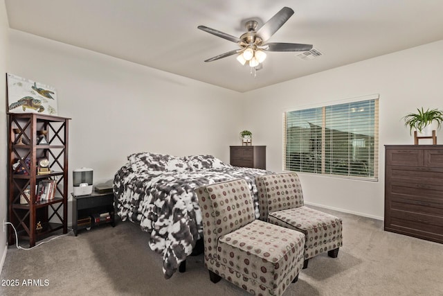 bedroom with ceiling fan and light carpet