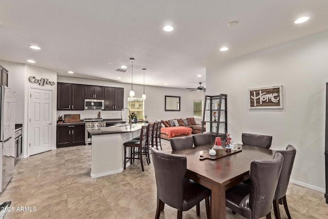 dining room featuring sink and ceiling fan