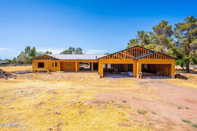 18526 E Cloud Rd, Queen Creek, AZ 85142 - exterior space with board and batten siding, an outbuilding, and an exterior structure