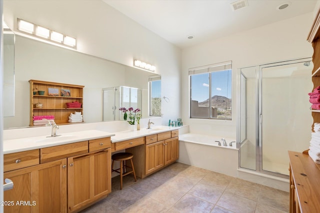 full bath featuring a bath, a stall shower, visible vents, and a sink