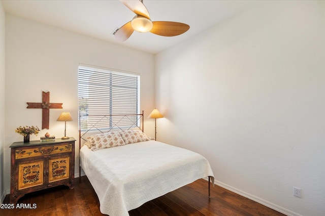 bedroom featuring dark wood-style floors, baseboards, and a ceiling fan