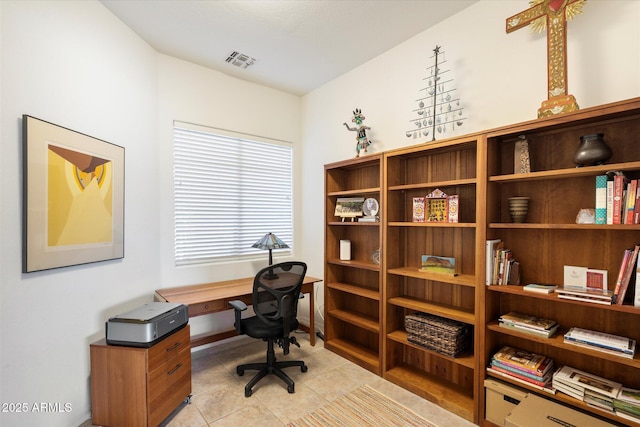 home office with light tile patterned flooring and visible vents